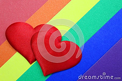 Rainbow homosexual color background with red hearts Stock Photo