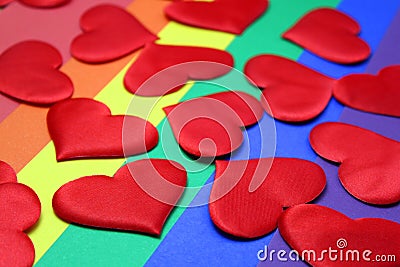 Rainbow homosexual color background with red hearts Stock Photo