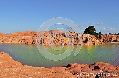 rainbow lake among the red rocks Stock Photo