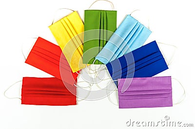 Rainbow of medical masks.Seven multi-colored masks Stock Photo