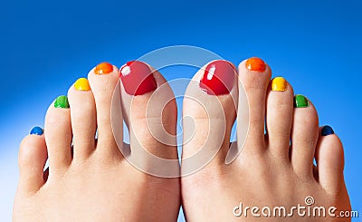 Rainbow nail polish feet Stock Photo