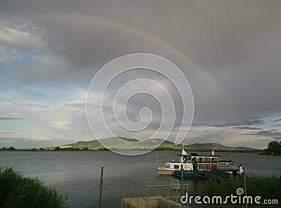 Rainbow over the lake and hills in South Moravia Stock Photo