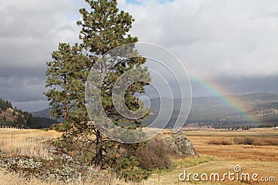 Rainbow over Montana Ranch in autumn Stock Photo