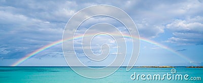 Rainbow over ocean Stock Photo