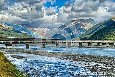 Rainbow over the Waimakariri River, NZ Stock Photo