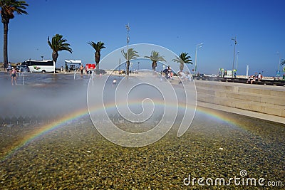 Rainbow produced in artificial water fountain Editorial Stock Photo