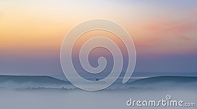 Rainbow skies in the Dorset Purbeck Hills above Corfe Castle Stock Photo