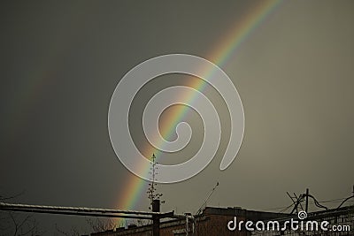 Rainbow in sky. Beautiful weather. Decomposition of light into colors Stock Photo