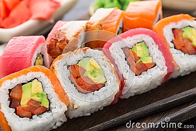 Rainbow sushi roll with salmon, tuna and eel Stock Photo