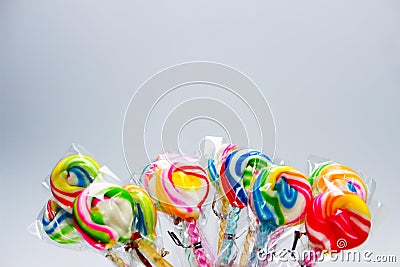 Rainbow Swirl Ripple Lollipops. Stock Photo