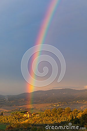 Rainbow in Tuscan countryside Stock Photo