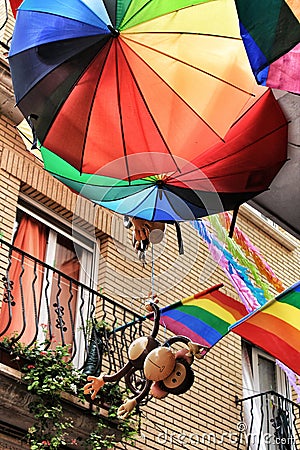 Rainbow umbrellas and flags decorating the streets Editorial Stock Photo