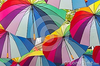 Rainbow Umbrellas hanging overhead in 4th Arrondissement, Le Marais, Paris, France Editorial Stock Photo