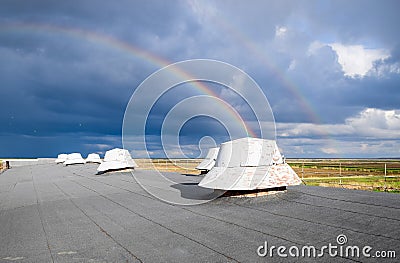 Rainbow, view from the roof of the building. Ventilation outlets Stock Photo