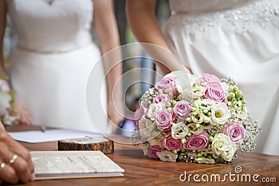 Two brides - lesbian wedding with bouquet Stock Photo