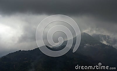 Rainclouds over hills Stock Photo