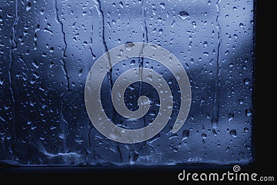 Background raindrop on window glass dark blue Stock Photo