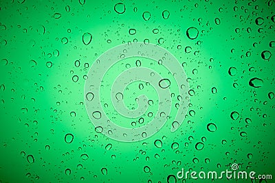 Close up of raindrops on a green glass Stock Photo