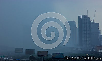 Raining stormy sky in bustling city. Tropical Climate Weather Background concept Stock Photo