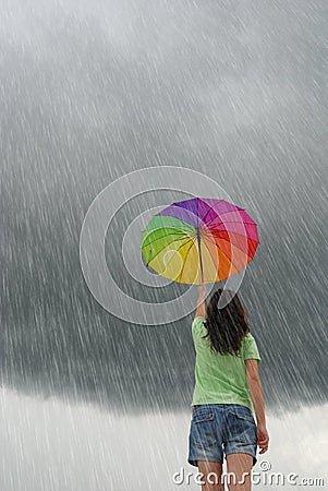 Raining wiht multicolor umbrella woman Stock Photo