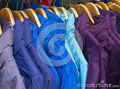 Rainproof jackets on a rack for sale. Stock Photo