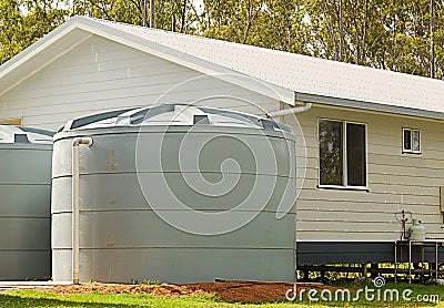 Rainwater conservation tanks on new house Stock Photo
