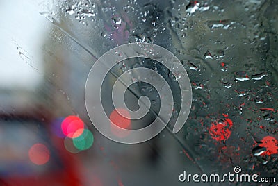 Rainy city scenery through wet windscreen Stock Photo