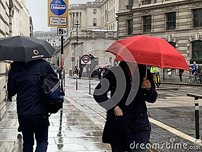 Rainy day in London city centre with people and umbrellas, England 2021 Editorial Stock Photo