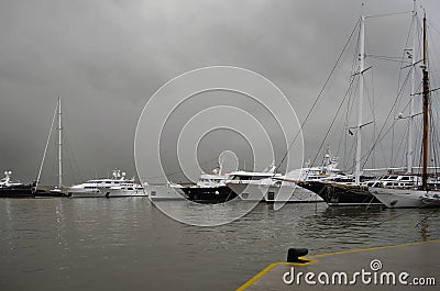 Rainy day and Yachts in a row at marina Zeas in Piraeus port Editorial Stock Photo