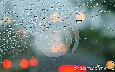 Rainy days,rain drops on the window with traffic blur Stock Photo