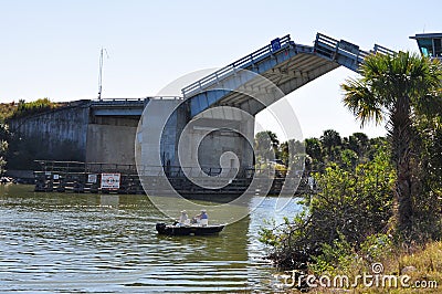 Raised Drawbridge and Fishermen Editorial Stock Photo