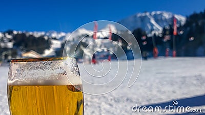 Raising a glass to the snowy mountains Stock Photo