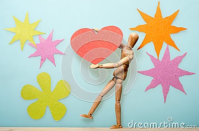 Raising a paper heart. Stock Photo