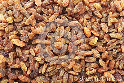 Raisins a lot for background. Dried seedless grapes. Healthy nutrition with fruits. Dried fruit as healthy snack Stock Photo