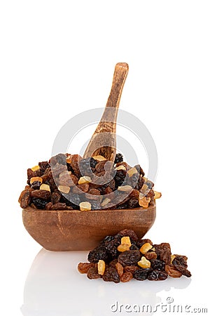 Raisins with mixed candied peel in wood bowl with spoon Stock Photo