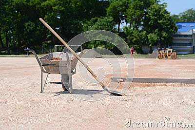 Rakes and mortar cart on construction site Stock Photo