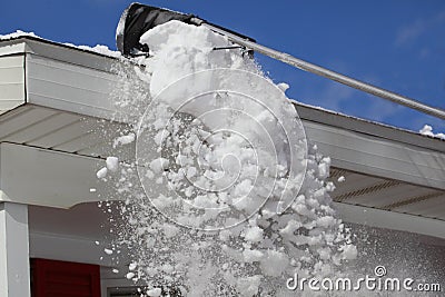 Raking Snow Stock Photo