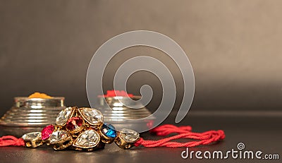 Raksha bandhan raakhi or rakhi with Kumkum on black background Stock Photo