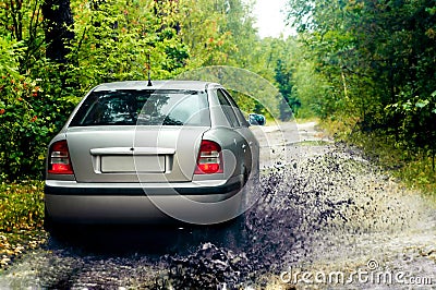 Rally car splashing water in t Stock Photo