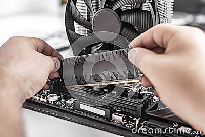 Installing random access memory into PC. Stock Photo
