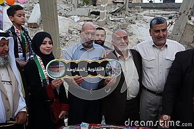 Ramadan breakfast over the rubble of houses demolished by Israeli warplanes during the last round Editorial Stock Photo