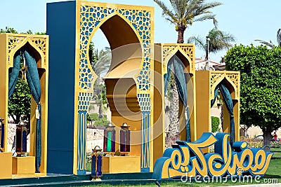 Ramadan festive decorations in the streets of Egypt, Islamic gates with curtains and Arabic lamps and lanterns Editorial Stock Photo