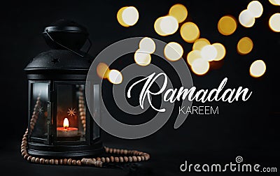 Ramadan Kareem Greeting Typography Beautiful Bokeh. Ramadan Candle Lantern with Wooden Prayer Beads Stock Photo