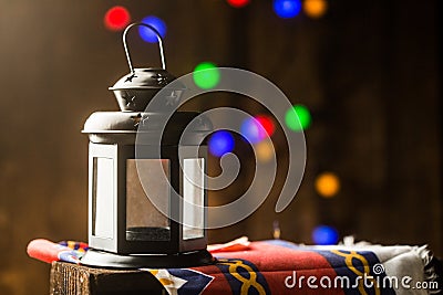 Ramadan lantern with bokeh dotes and ramadan themed cloth shot on dark wood Stock Photo