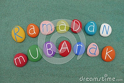 Ramadan Mubarak text, islamic holiday composed with multi colored stones Stock Photo