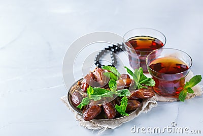 Ramadan ramazan kareem. Traditional arabic tea with mint and dates Stock Photo