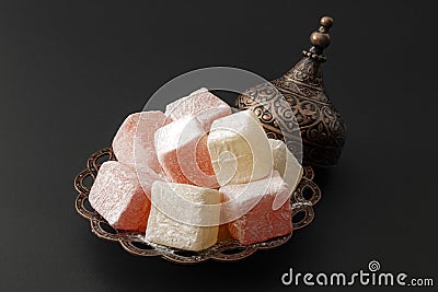Ramadan sweets and middle eastern soft sweet treat concept with close up on serving of Turkish delights on ornate metal plate Stock Photo