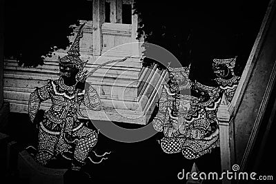 The Ramakian Ramayana mural paintings color black and white along the galleries of the Temple of the Emerald Buddha, grand palac Stock Photo