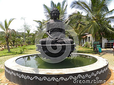 Ramanagara, Karnataka, India - January 1, 2009 Black color stone statue of Lord Buddha in meditation Editorial Stock Photo