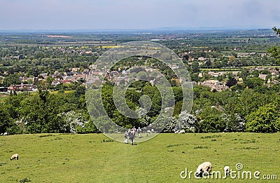 Ramblers on a Cotswold trail into Broadway Village Stock Photo